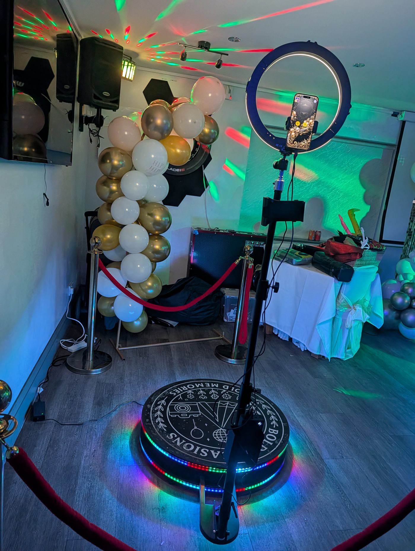 360 photo booth with balloon arch and disco lights